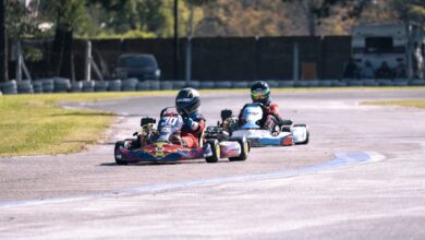 Competitive go-kart racing action captured on an outdoor circuit.