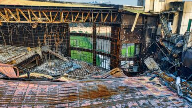 Drone shot of a fire-damaged building in Banten, Indonesia showing twisted metal and rubble.
