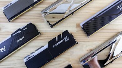 Top view of modern computer RAM sticks arranged on a wooden surface for technology enthusiasts.