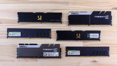 Top view of various RAM sticks arranged on a wooden surface, showcasing computer memory technology.