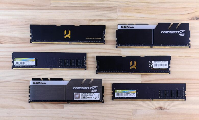 Top view of various RAM sticks arranged on a wooden surface, showcasing computer memory technology.