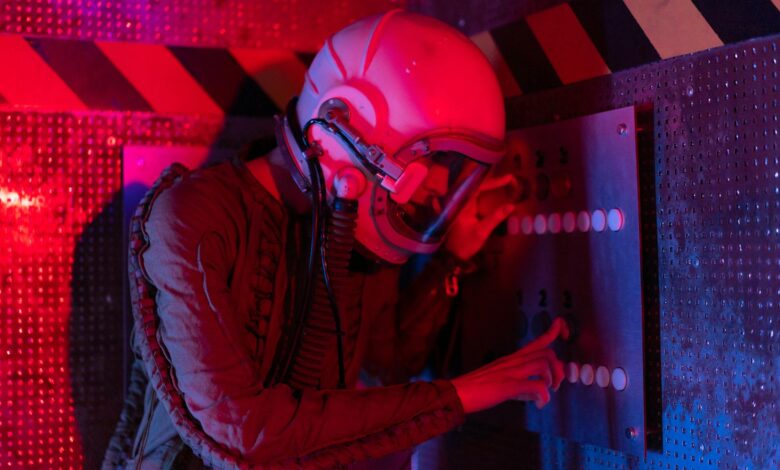 Female astronaut interacts with a control panel in a futuristic spaceship setting.