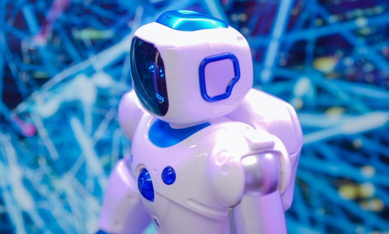 Close-up of a white and blue robot against a dynamic, futuristic tech backdrop.