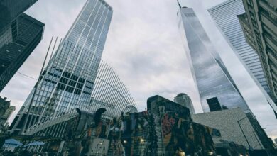 Skyscrapers and urban art converge in Lower Manhattan featuring One World Trade Center.
