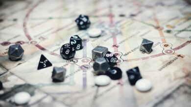 A collection of multi-sided dice on a detailed map, ideal for gaming enthusiasts