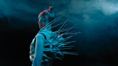 Side profile of a woman in a spiky bodysuit, exuding sci-fi vibes.