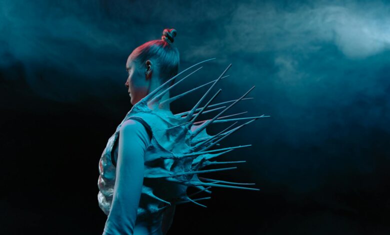 Side profile of a woman in a spiky bodysuit, exuding sci-fi vibes.