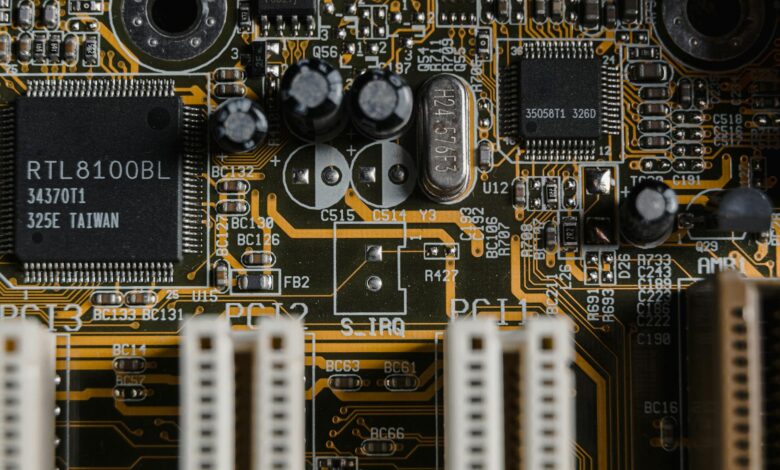 Detailed view of a motherboard with visible microchips and circuits.