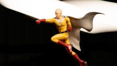 High-quality photo of a dynamic superhero action figure in a striking pose with a flowing cape.