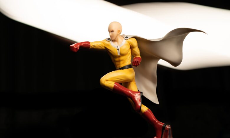 High-quality photo of a dynamic superhero action figure in a striking pose with a flowing cape.