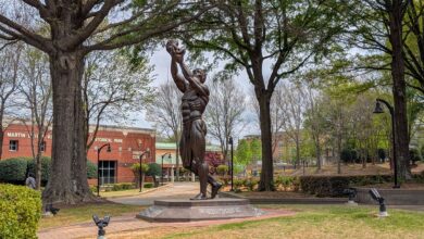 Statue at MLK Jr. Historical Park, Atlanta, surrounded by spring foliage.