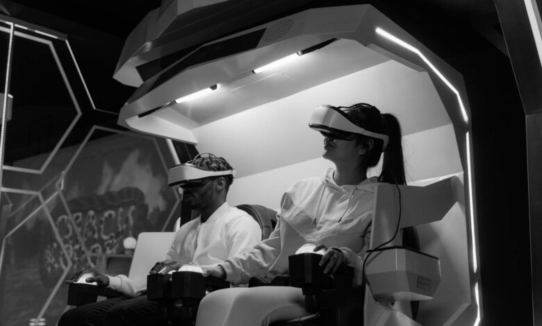 Immersive virtual reality gaming session with players wearing VR headsets, captured in black and white.