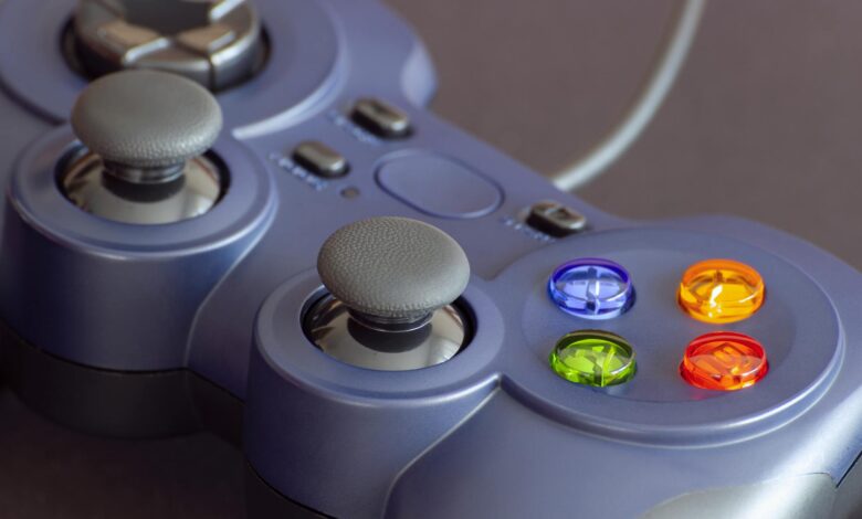 Detailed close-up of a gaming controller emphasizing its vibrant buttons.