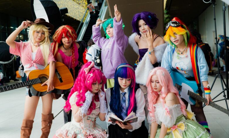 Vibrant group of cosplayers in anime costumes with musical instruments, showcasing diversity.