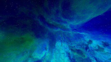 A mesmerizing view of a colorful cosmic nebula with sparkling stars in the night sky.