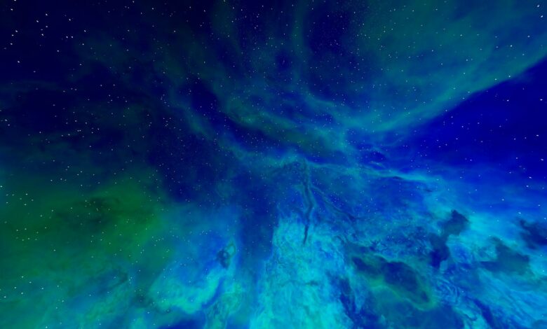 A mesmerizing view of a colorful cosmic nebula with sparkling stars in the night sky.