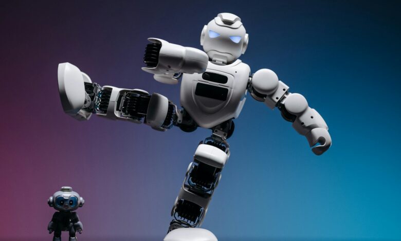 Close-up of two futuristic robots in a studio setting, showcasing advanced robotics and innovation.