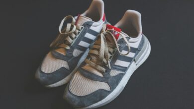 Close-up of Adidas sneakers with laces, ideal for running and fashion-forward footwear.