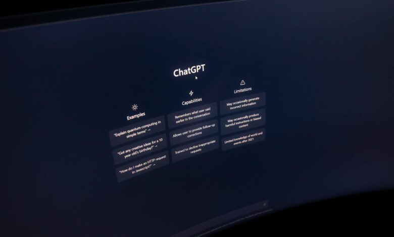 Close-up of a computer screen displaying ChatGPT interface in a dark setting.
