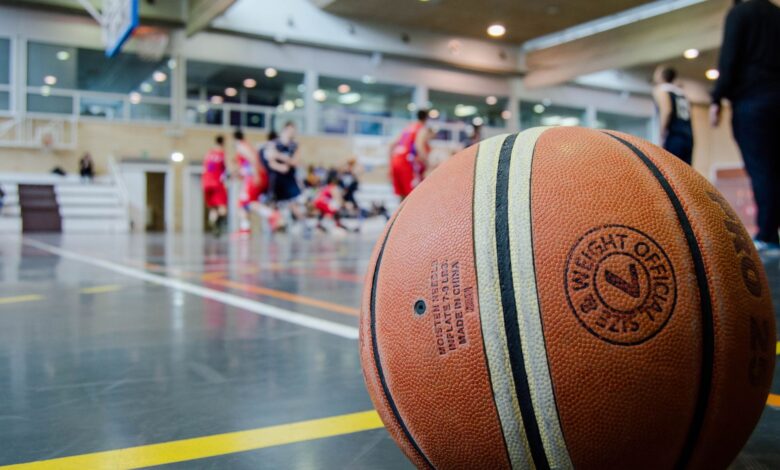 Captivating indoor basketball scene with players actively engaged in a game.