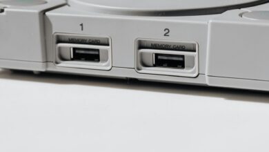 Detailed view of vintage PlayStation console featuring memory slots, capturing nostalgia.