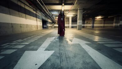 Creepy apparition in a dim parking garage setting. Perfect for horror themes.