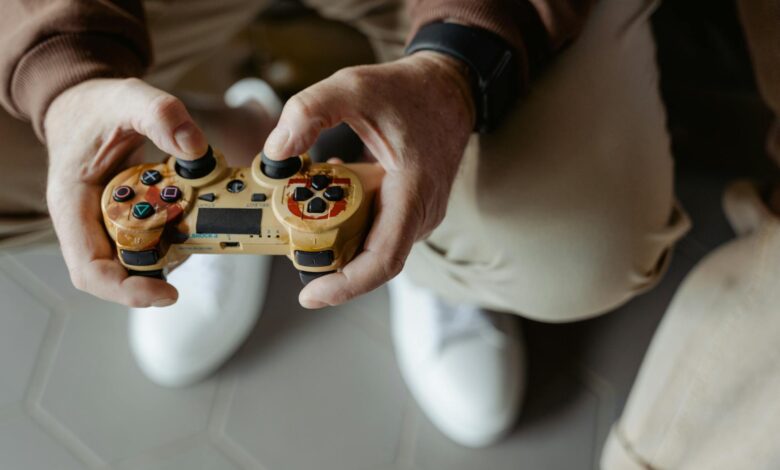 A person playing video games with a vintage-style controller indoors.