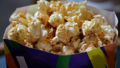 Close-up of crunchy popcorn in a vibrant box, perfect for snack time.
