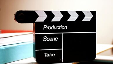 Close-up of a film clapperboard on a desk, ideal for media and production themes.