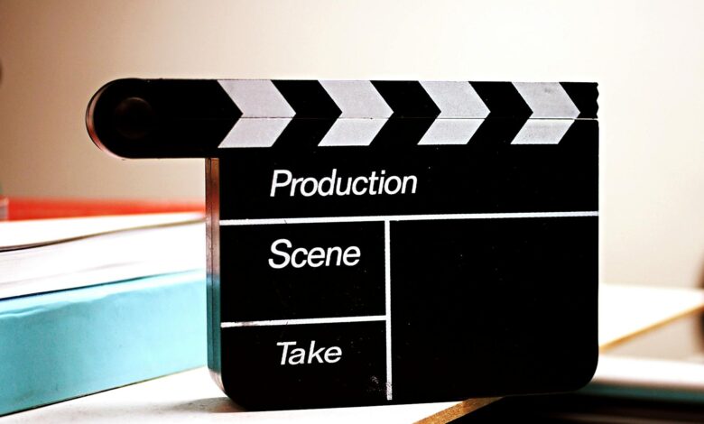 Close-up of a film clapperboard on a desk, ideal for media and production themes.