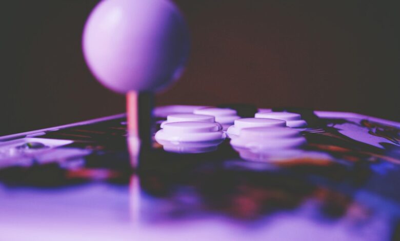 A vibrant close-up image of an arcade joystick and buttons, capturing a retro gaming mood.