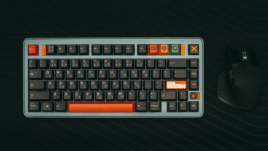 Stylish mechanical keyboard with gaming keys and ergonomic mouse on dark background.