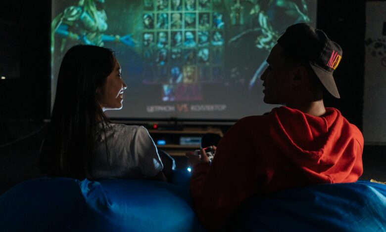 Two friends enjoy a cozy gaming night together on a video game console.