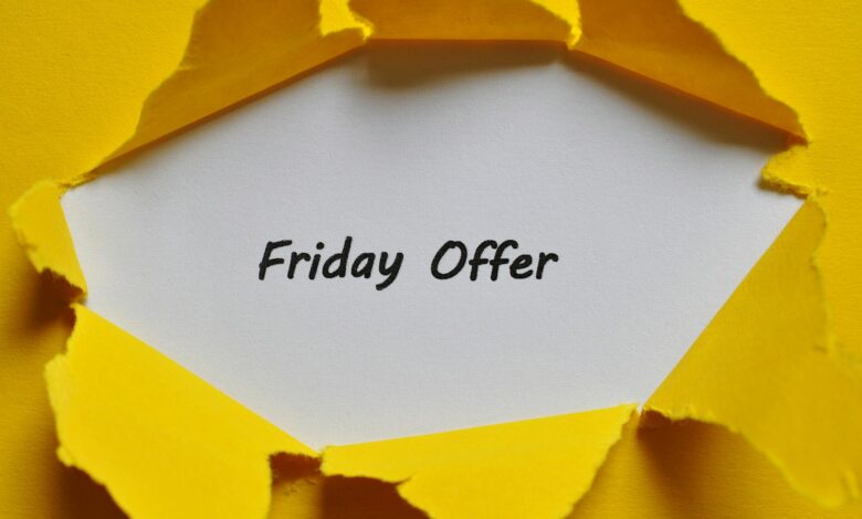 Yellow torn paper reveals Friday offer message, perfect for promotions.