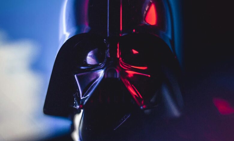 Close-up of a Darth Vader mask with striking lighting effects, showcasing cinematic appeal.