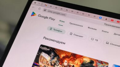 Close-up of a tablet displaying the Google Play Store interface in Russian.