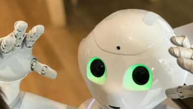 A futuristic humanoid robot with glowing green eyes in a modern setting.