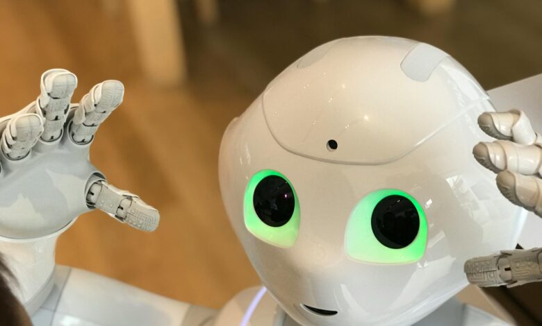 A futuristic humanoid robot with glowing green eyes in a modern setting.