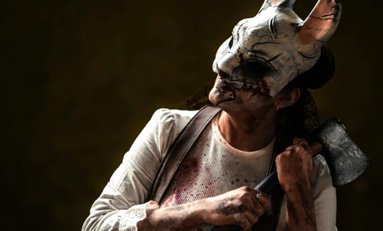 Creepy figure in rabbit mask holding axe, evoking horror theme. Perfect for Halloween content.