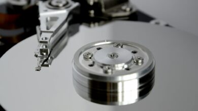 Detailed view of hard drive mechanism showcasing metallic precision parts.