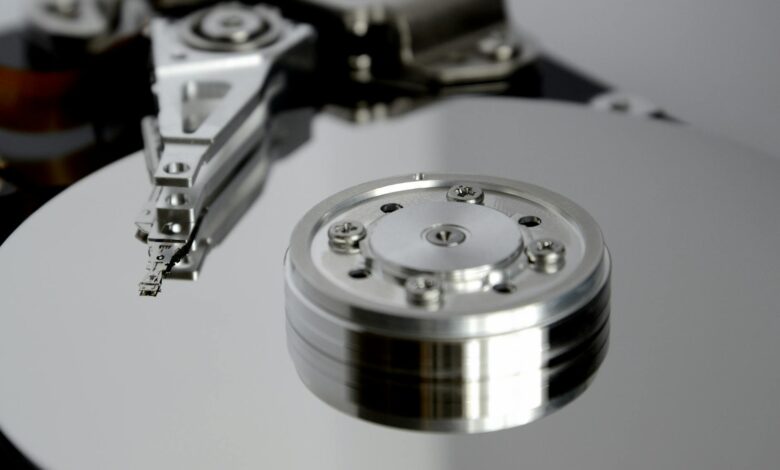 Detailed view of hard drive mechanism showcasing metallic precision parts.