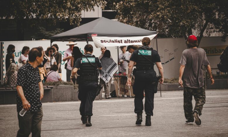 Police officers monitoring a protest in Brisbane City, Australia.