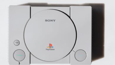 Close-up of a classic Sony PlayStation console on a white background