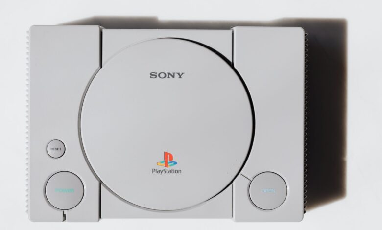 Close-up of a classic Sony PlayStation console on a white background