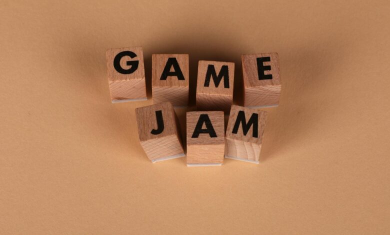 Wooden blocks spelling 'GAME JAM' on a plain brown surface. Perfect for gaming concepts.