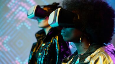 Two women wearing VR headsets immersed in a vivid digital world. Explore technology.