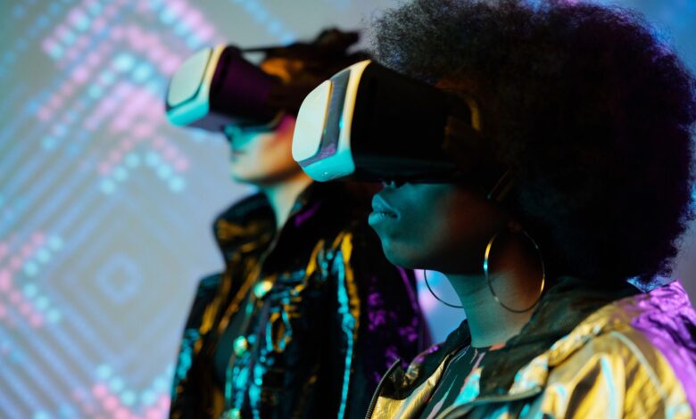 Two women wearing VR headsets immersed in a vivid digital world. Explore technology.