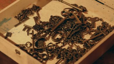 A close-up of vintage keys in a wooden box, evoking nostalgia and mystery.