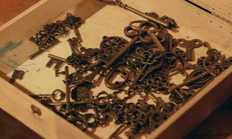 A close-up of vintage keys in a wooden box, evoking nostalgia and mystery.