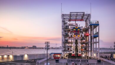 A stunning sunset view of the Gundam robot at Yokohama's waterfront, Japan.